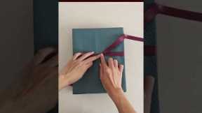 How to tie a ribbon bow on gift box