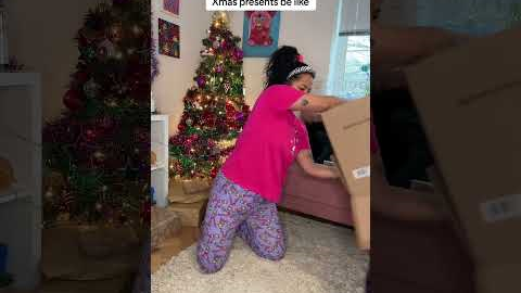 Little kids opening Christmas Presents